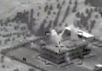 Il fermo immagine tratto da un video dell'U.S. Central Command, postato su Youtube, mostra uno dei  raid avvenuti in Siria la notte scorsa © Ansa