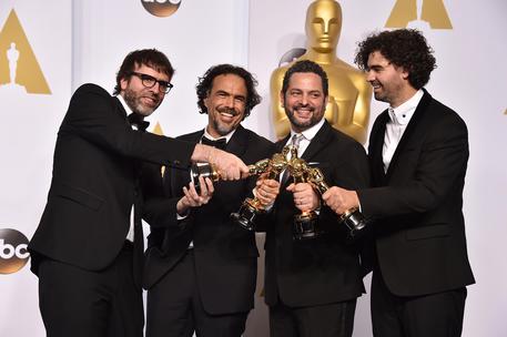 Nicolas Giacobone, and from left, Alejandro Gonzalez Inarritu, Alexander Dinelaris and Armando Bo © AP