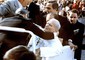Giovanni Paolo II, sorretto dai collaboratori, qualche istante  dopo l'attentato, il 13 maggio 1981 © ANSA